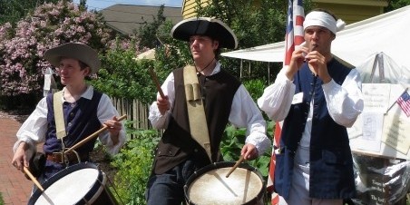 3 Boys playing fife and drum at an Open House